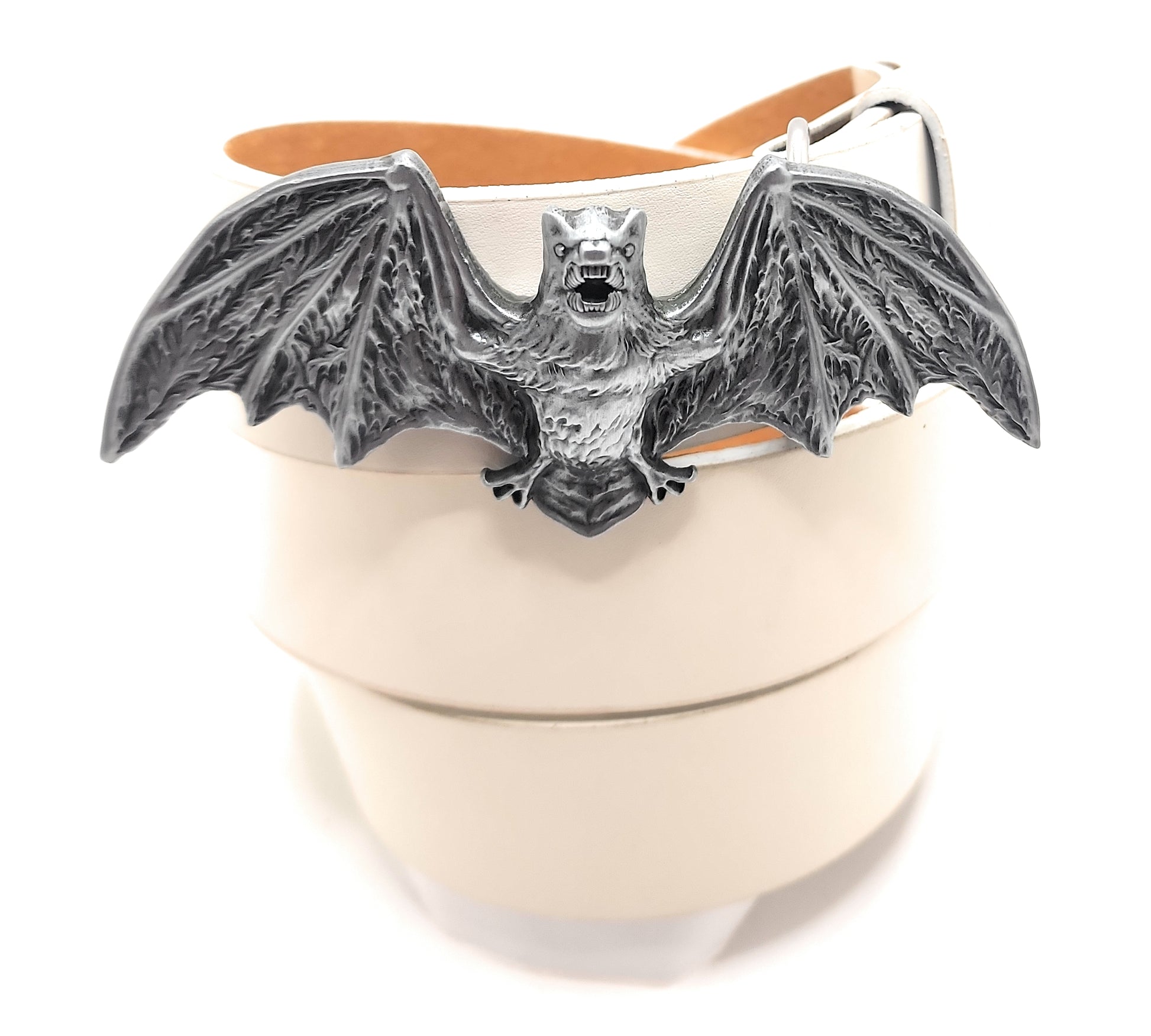 Belt with a bat-shaped buckle on a white leather belt strap against a white background